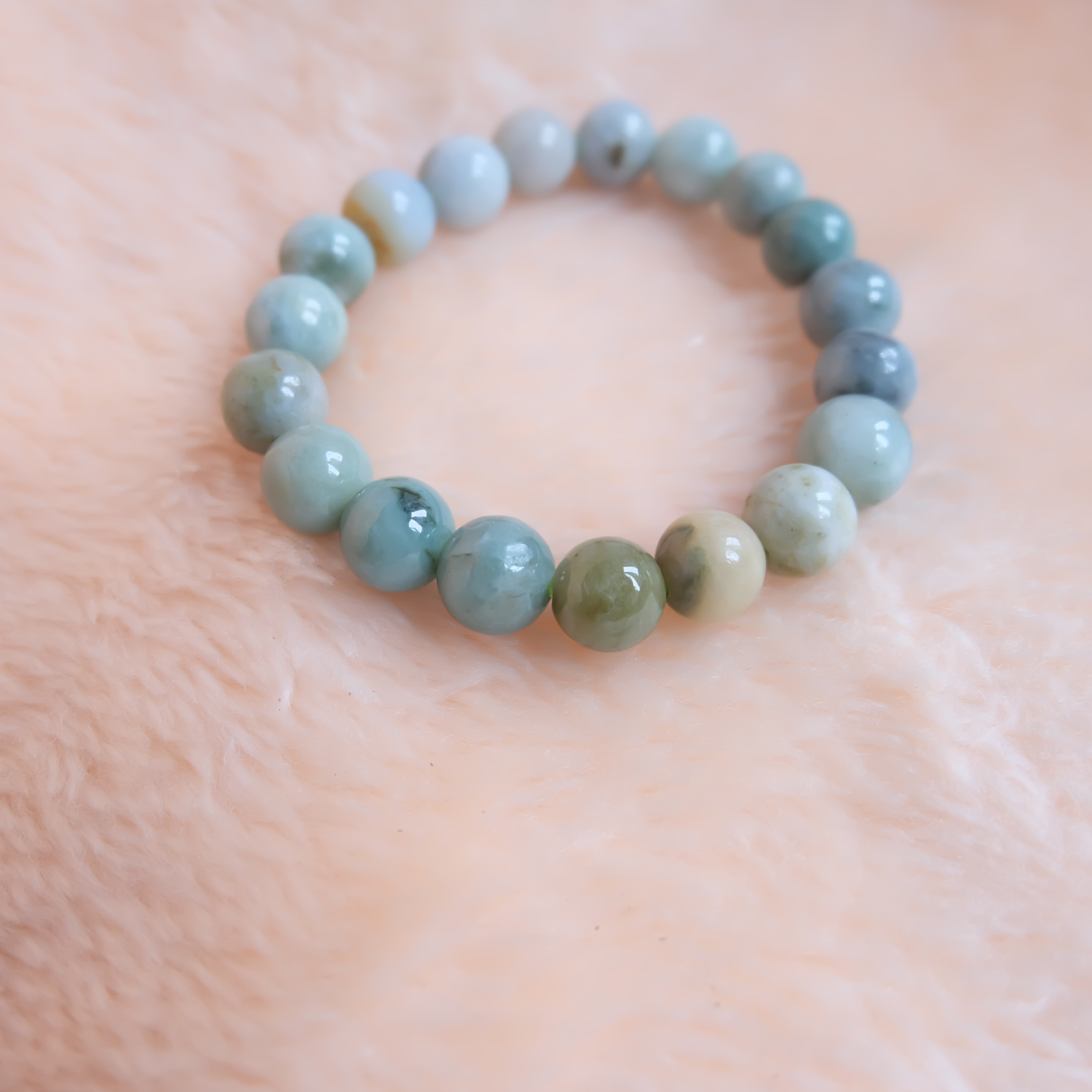 สร้อยข้อมือลูกปัดหยกแท้ หยกพม่า หยกคละสี หยกเจไดต์ ขนาด 10 มิล รอบข้อมือ 16.5 เซนติเมตร ร้อยด้วยไหมยืด ไม่ค่อยกลม