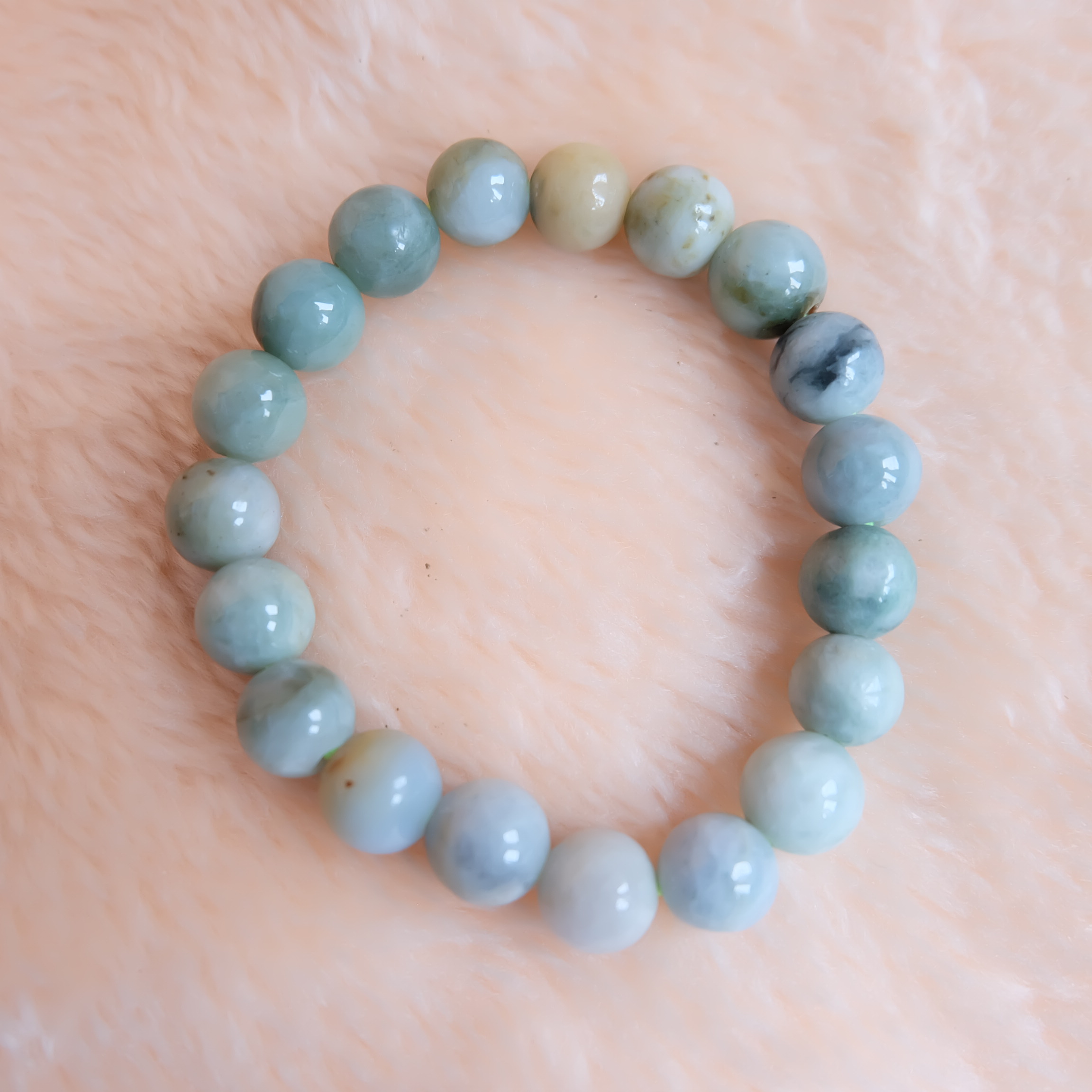 สร้อยข้อมือลูกปัดหยกแท้ หยกพม่า หยกคละสี หยกเจไดต์ ขนาด 10 มิล รอบข้อมือ 16.5 เซนติเมตร ร้อยด้วยไหมยืด ไม่ค่อยกลม