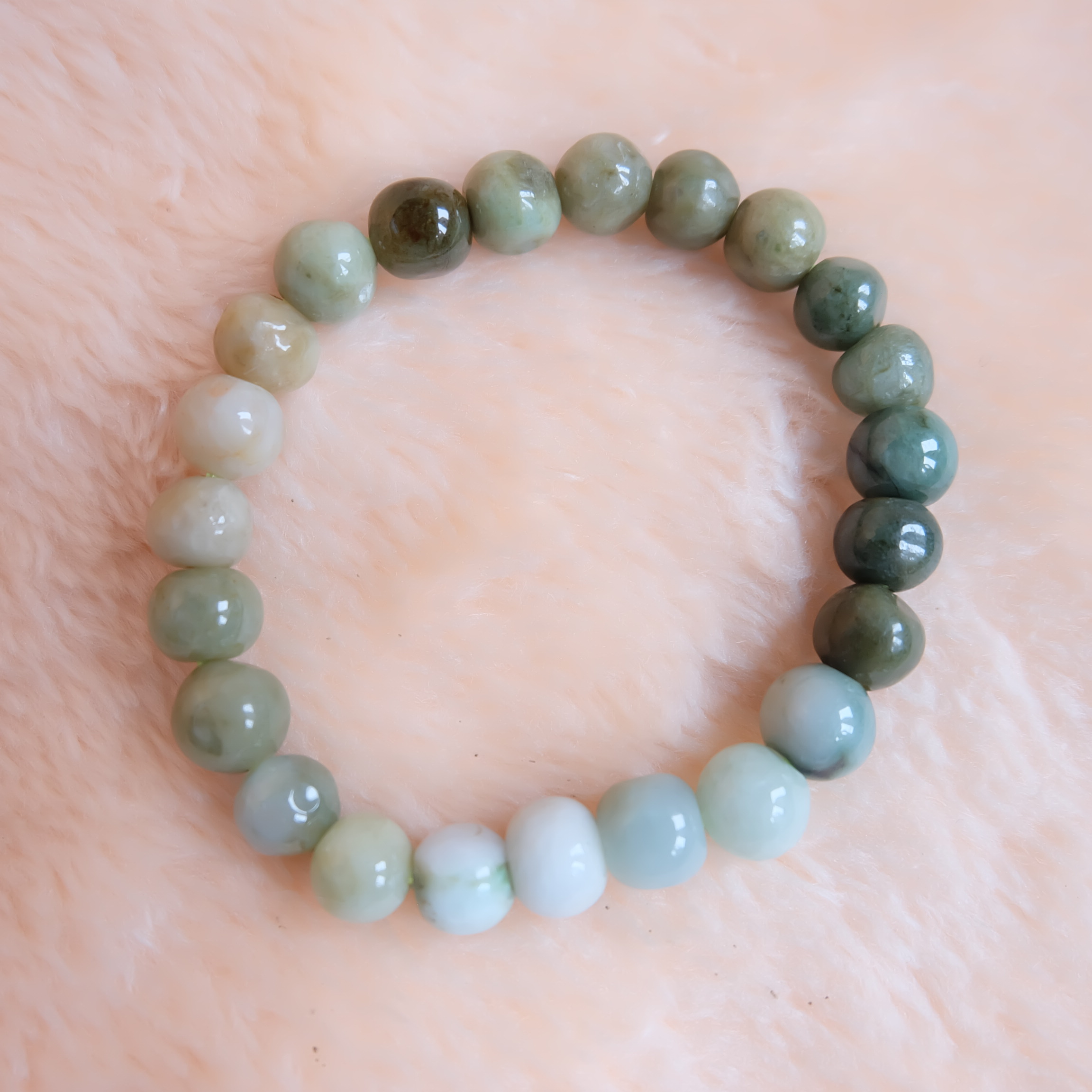 สร้อยข้อมือลูกปัดหยกแท้ หยกพม่า หยกคละสี หยกเจไดต์ ขนาด 10 มิล รอบข้อมือ 19 เซนติเมตร ร้อยด้วยไหมยืด ไม่ค่อยกลม