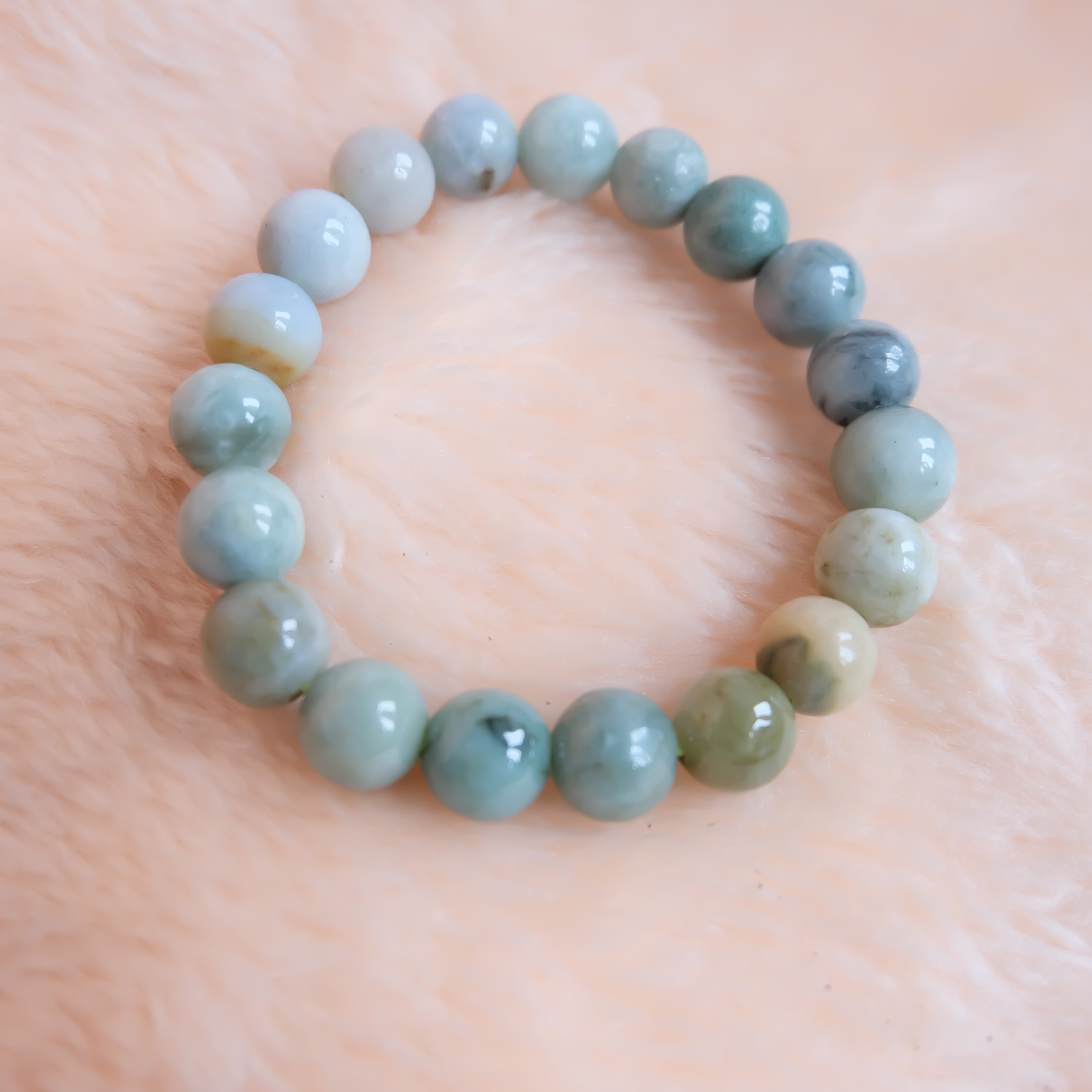 สร้อยข้อมือลูกปัดหยกแท้ หยกพม่า หยกคละสี หยกเจไดต์ ขนาด 10 มิล รอบข้อมือ 16.5 เซนติเมตร ร้อยด้วยไหมยืด ไม่ค่อยกลม