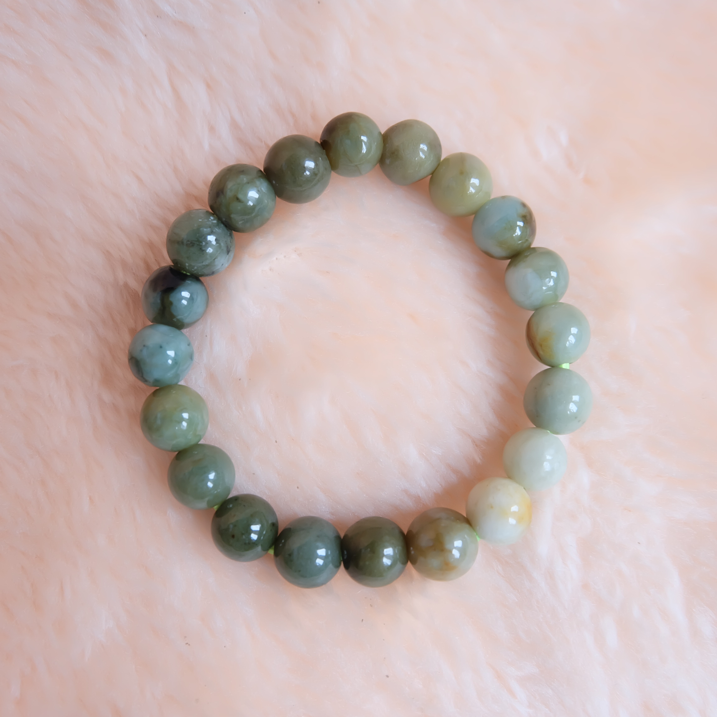 สร้อยข้อมือลูกปัดหยกแท้ หยกพม่า หยกคละสี หยกเจไดต์ ขนาด 10 มิล รอบข้อมือ 16.5 เซนติเมตร ร้อยด้วยไหมยืด ไม่ค่อยกลม